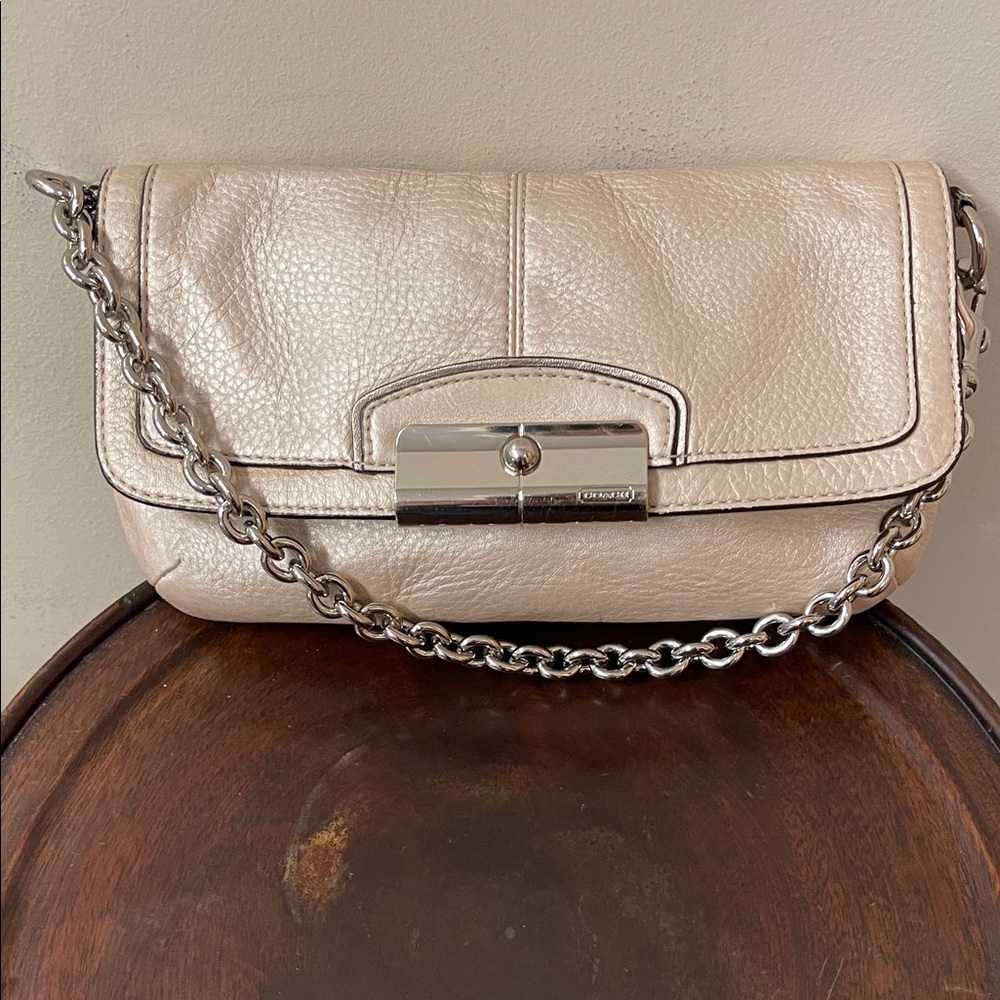 Coach metallic champagne/cream pebble leather wristlet with silver chain 8x4x1”